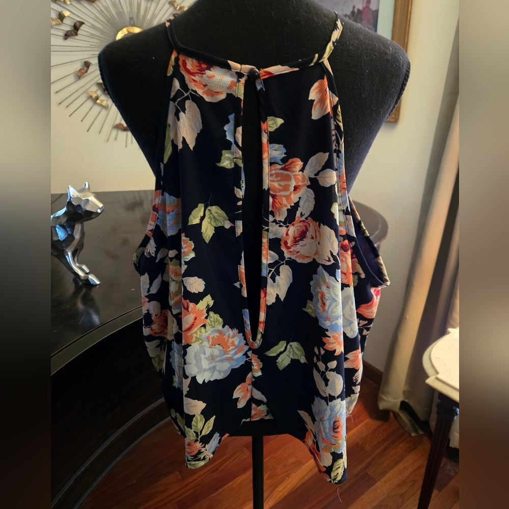 Pretty halter top with peekaboo front and open peekaboo back.